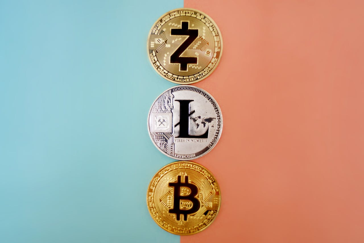 services-04 Colorful display of Zcash, Litecoin, and Bitcoin coins on gradient background.